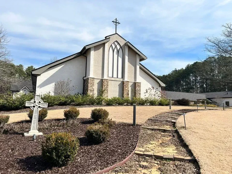 The Christ Church building, with the outdoor Stations of the Cross in the foreground.