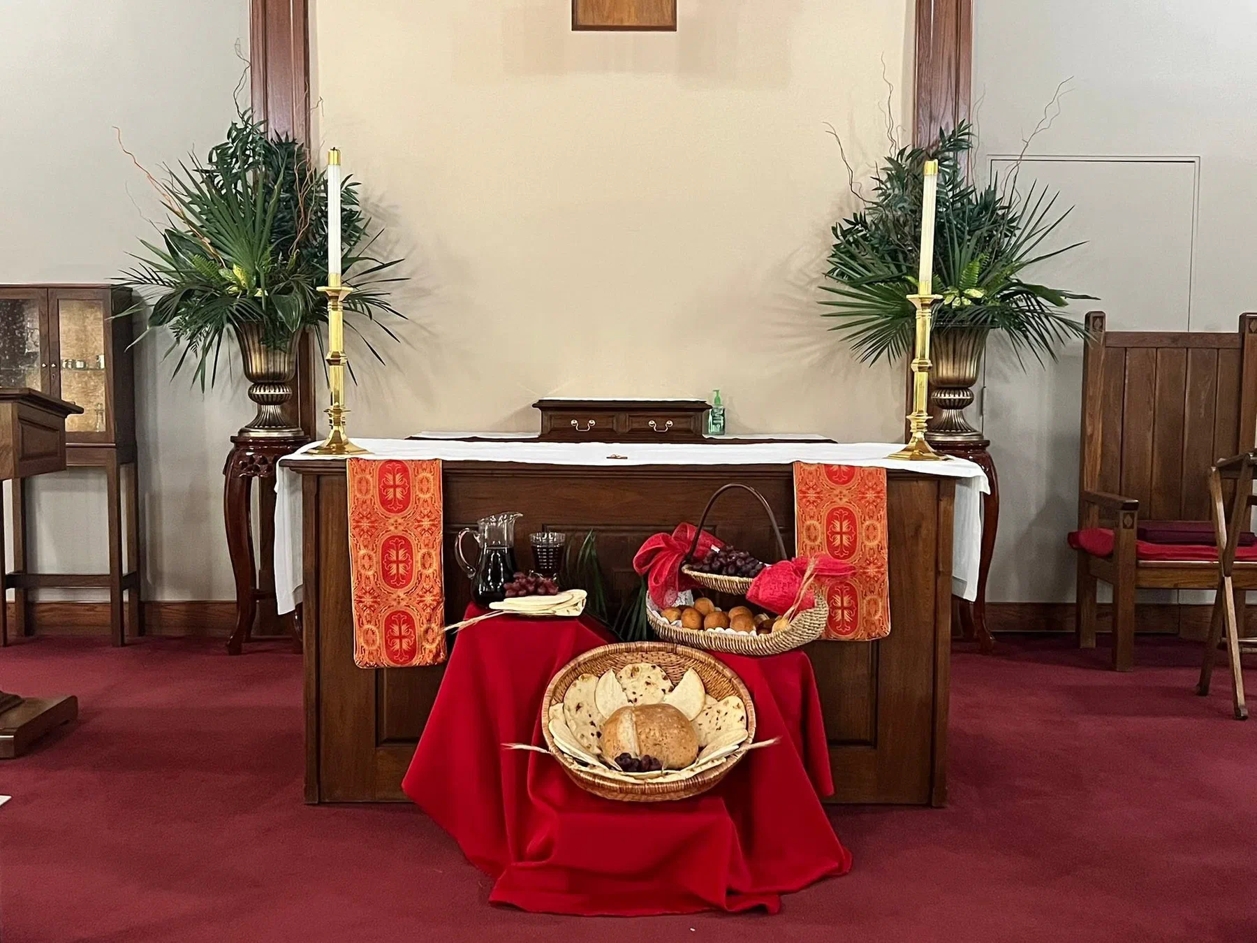 The altar dressed in red with palms for Holy Week.