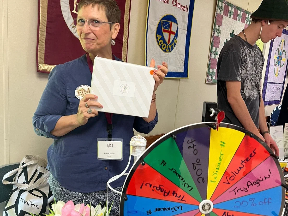 A parishioner presenting a ministry at the parish ministry fair.